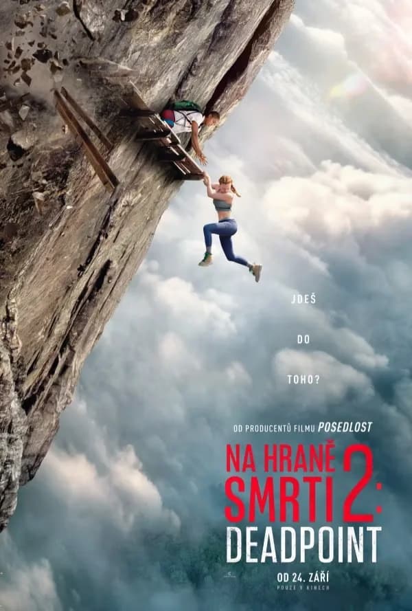 A climber helps a woman hanging from a precarious cliff above a sea of clouds.