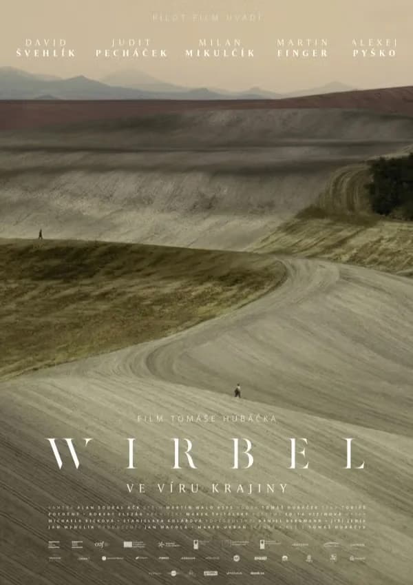 A lone figure walks across a vast, rolling landscape under a hazy sky on this movie poster.