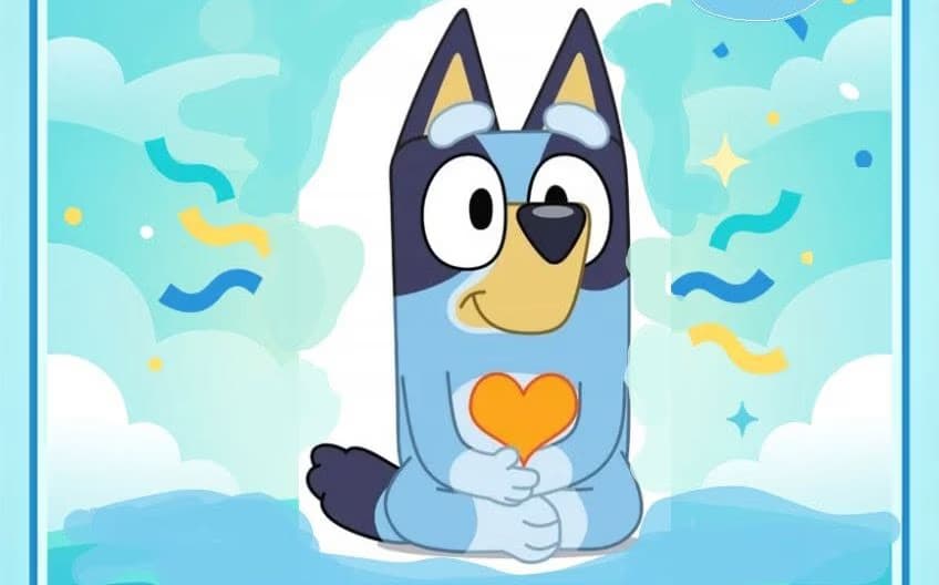 Bluey the cartoon dog sits holding an orange heart against a light blue, festive cloudy background.