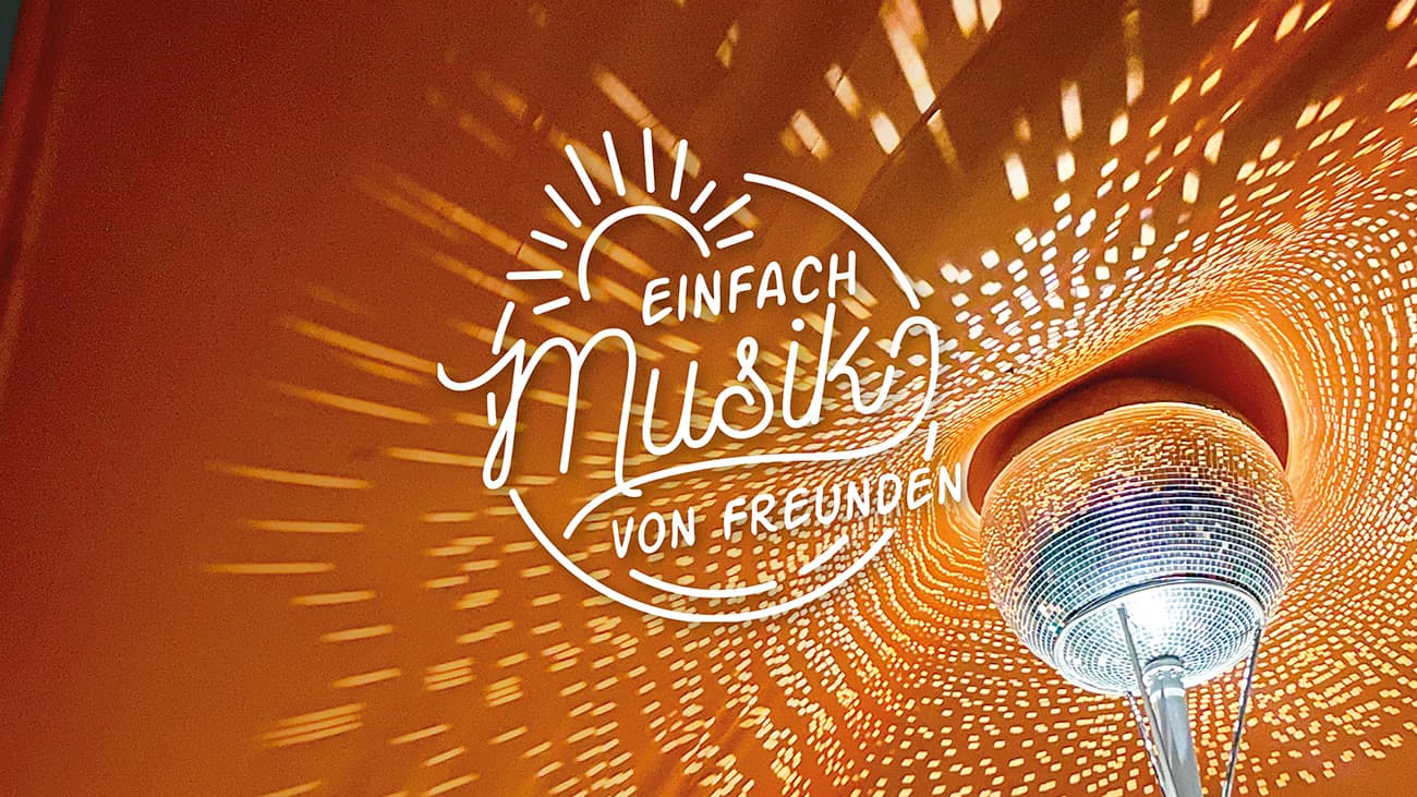 A glowing disco ball casts light patterns onto an orange background with superimposed text.