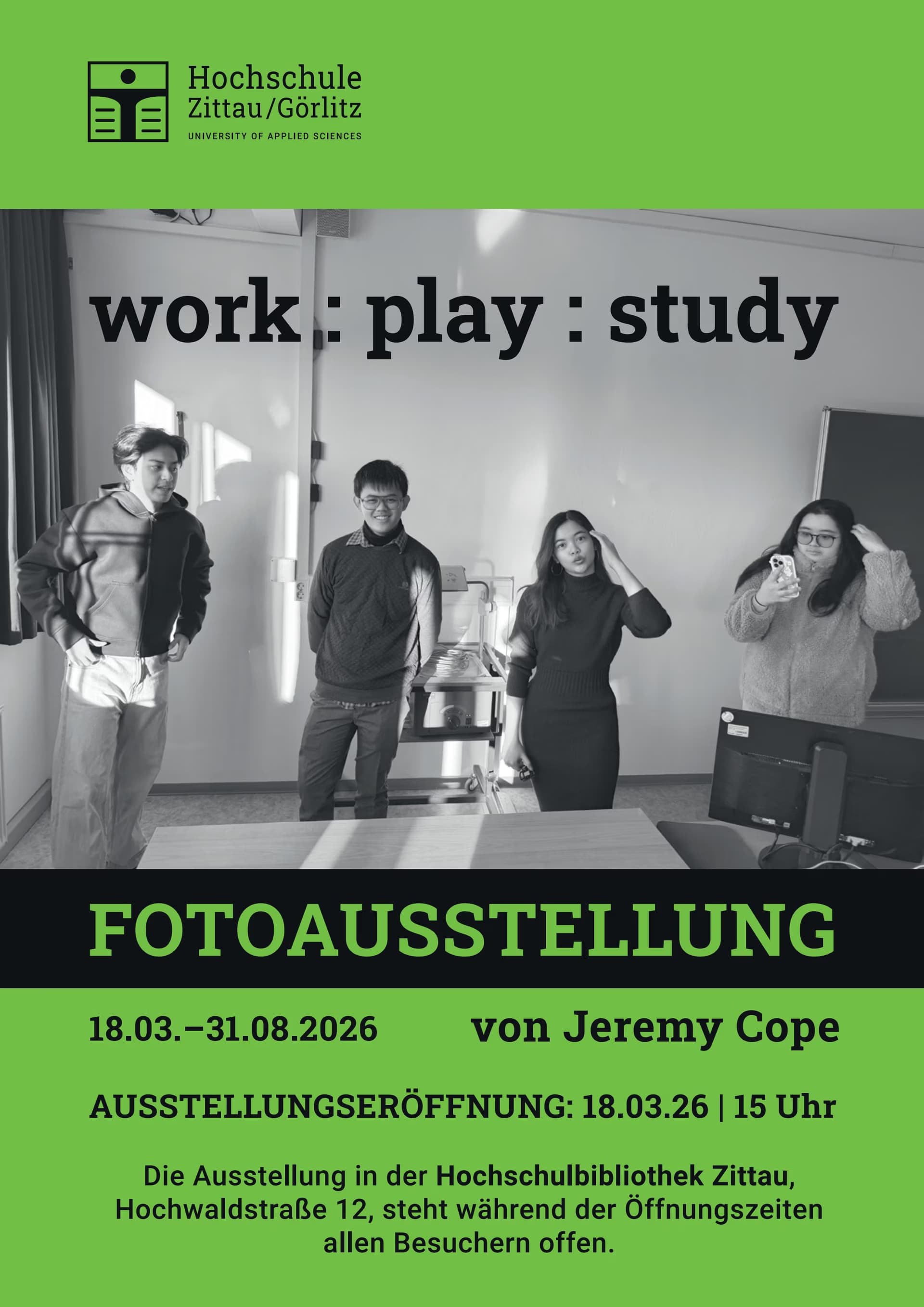 Four students stand in a room above text announcing an exhibition at Zittau/Görlitz University.