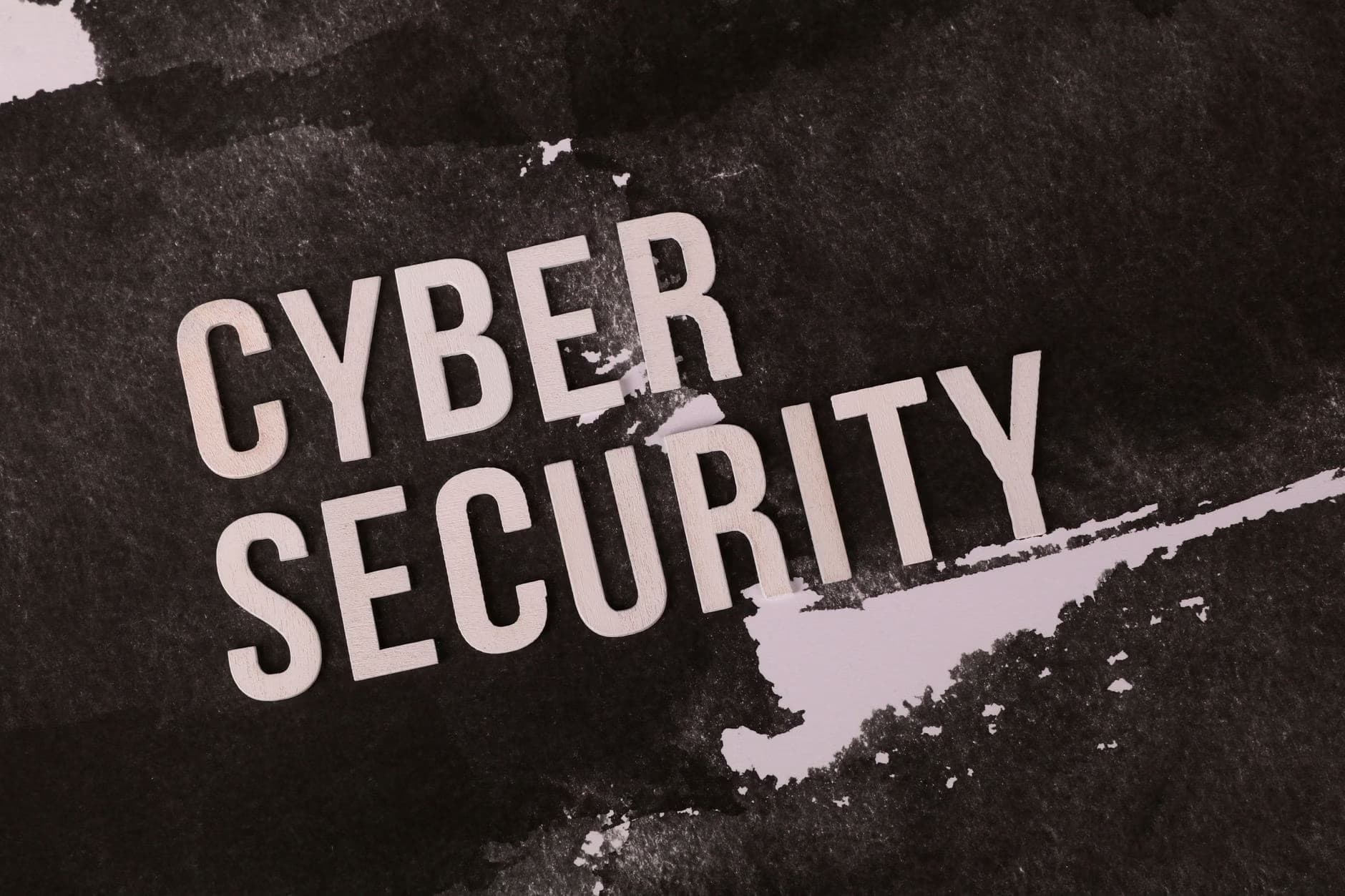 The words Cyber Security appear in bold light text against a dark textured background.